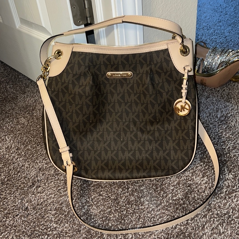Authentic Michael Kors brown and cream purse with gold accents.